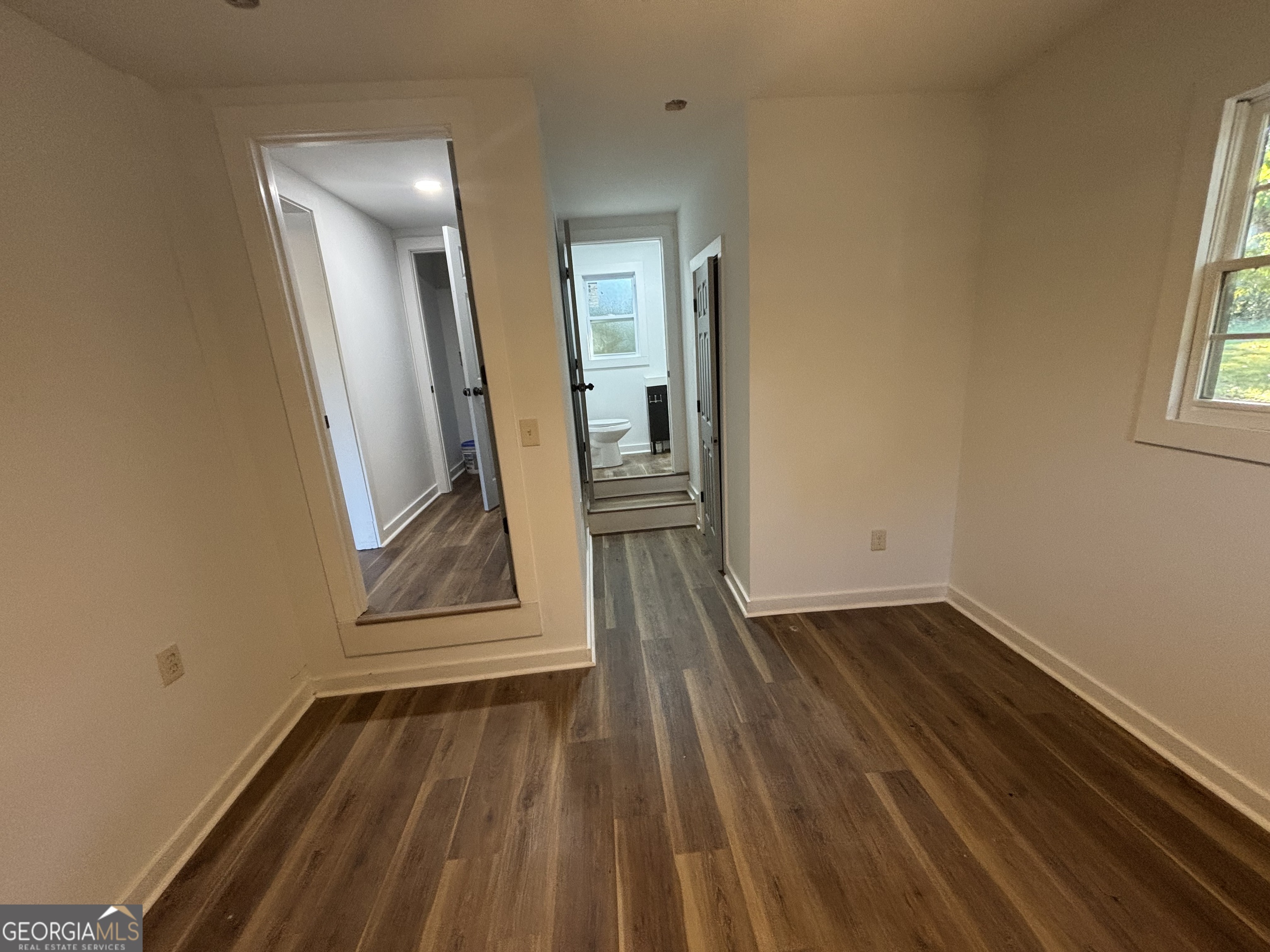 176 Randall Avenue Flovilla, GA 30216 - Photo 30 of 32 a view of a room with wooden floor and staircase