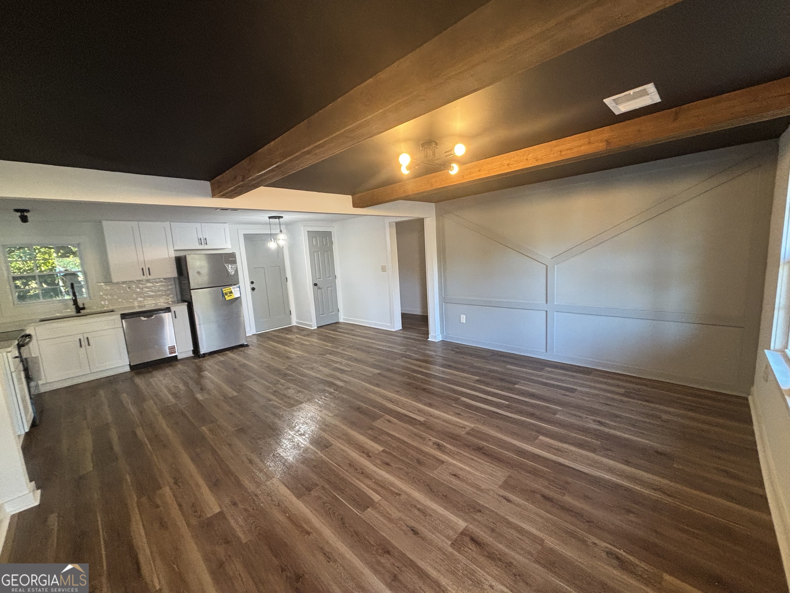 176 Randall Avenue Flovilla, GA 30216 - Photo 8 of 32 a view of empty room with wooden floor