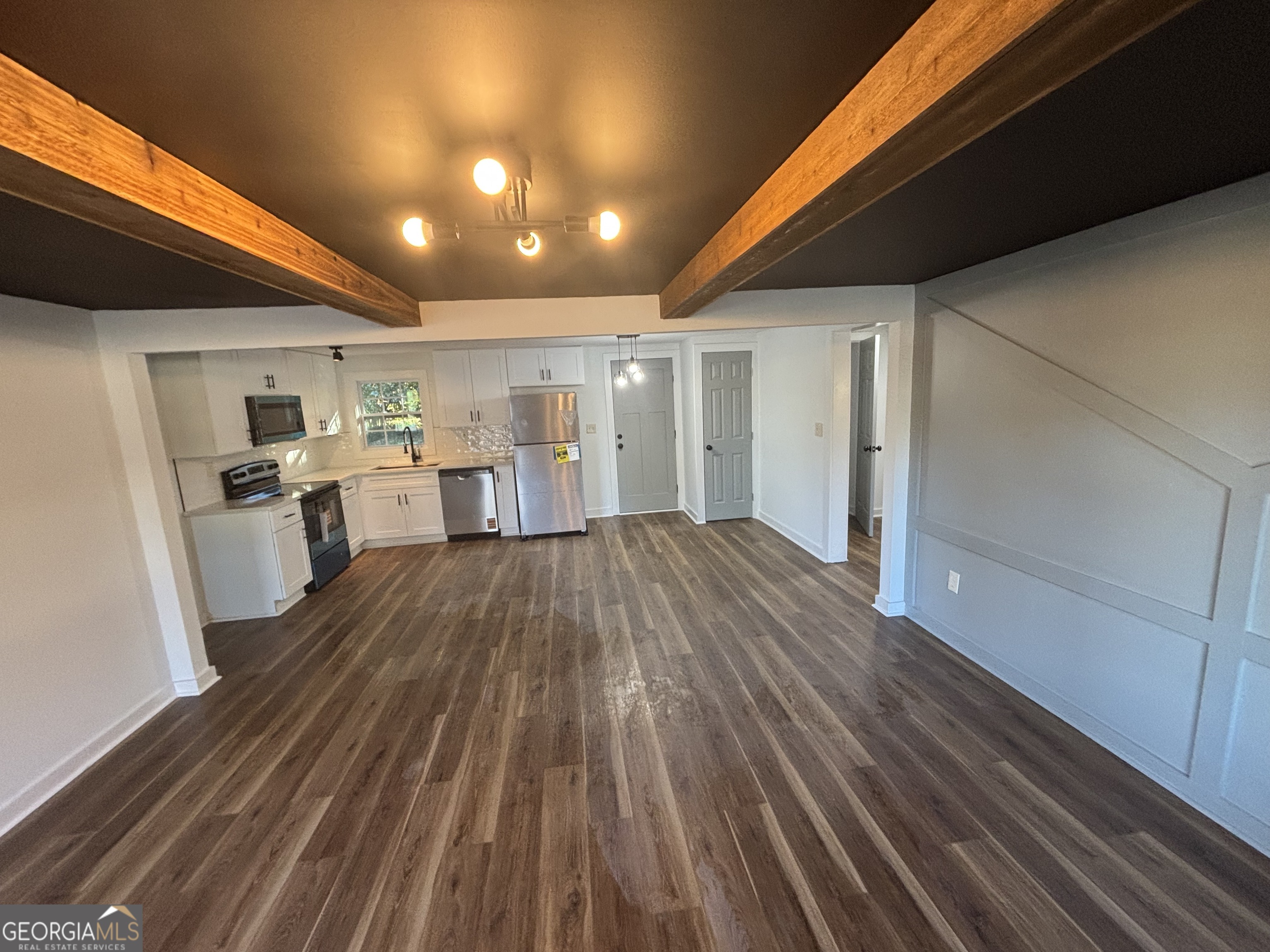 176 Randall Avenue Flovilla, GA 30216 - Photo 9 of 32 a view of empty room with wooden floor