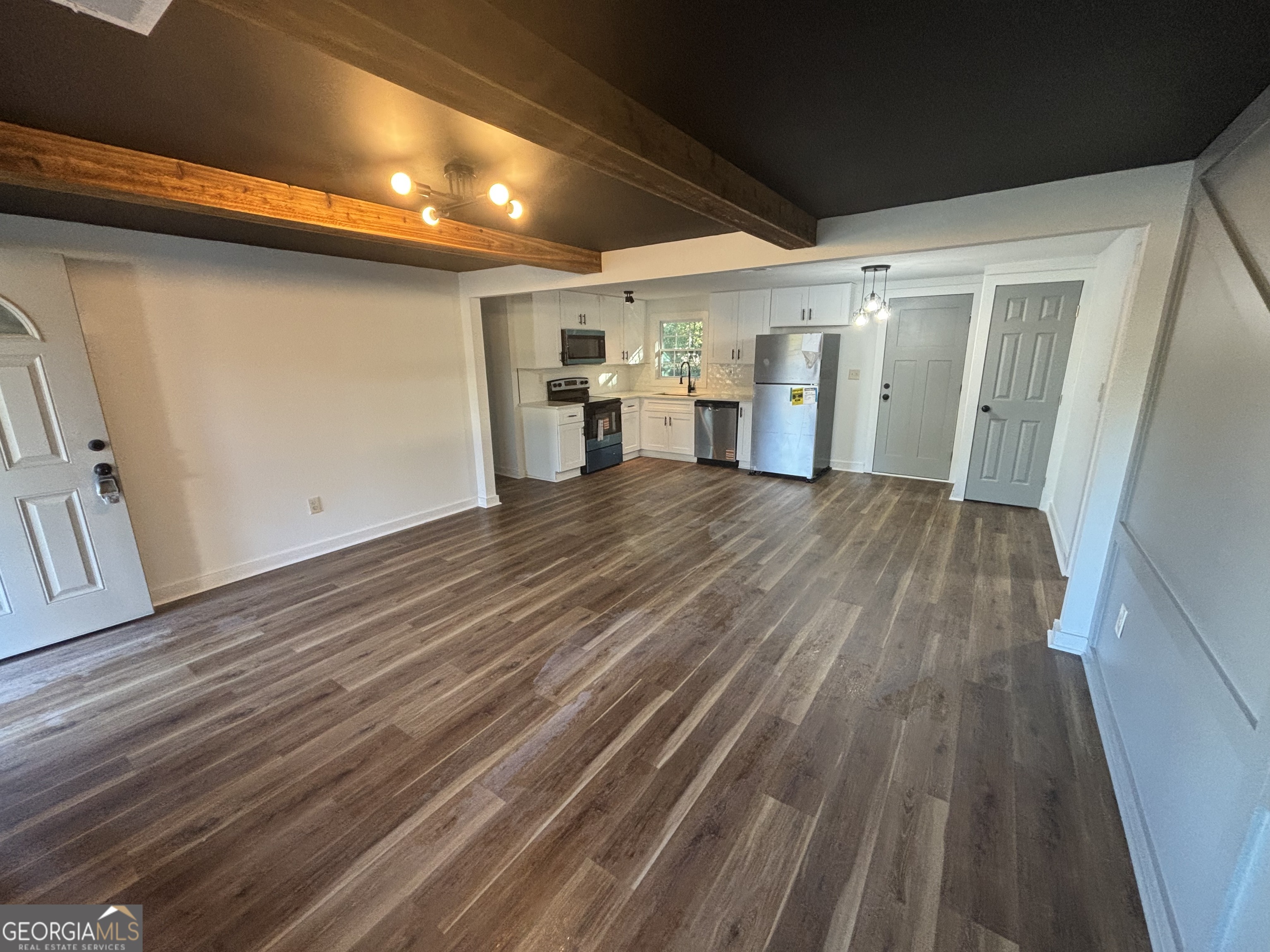 176 Randall Avenue Flovilla, GA 30216 - Photo 10 of 32 a view of empty room with wooden floor