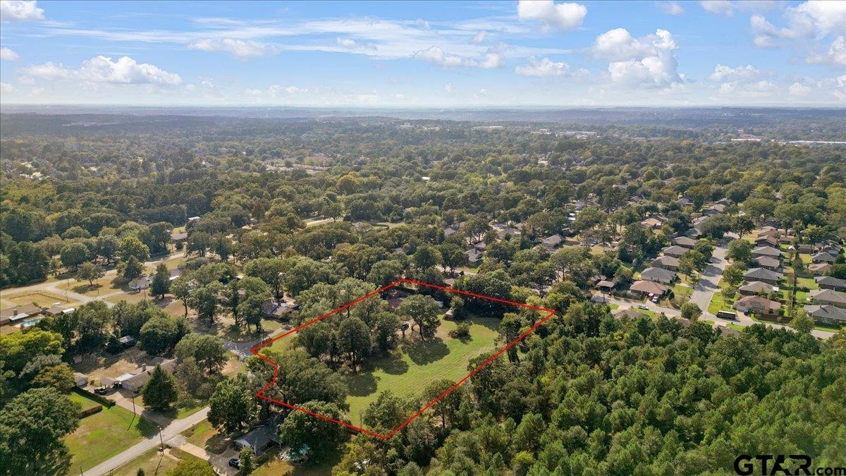 1302 Jeb Stuart Drive Tyler, TX 75703 - Photo 45 of 47 an aerial view of residential houses with city and green space