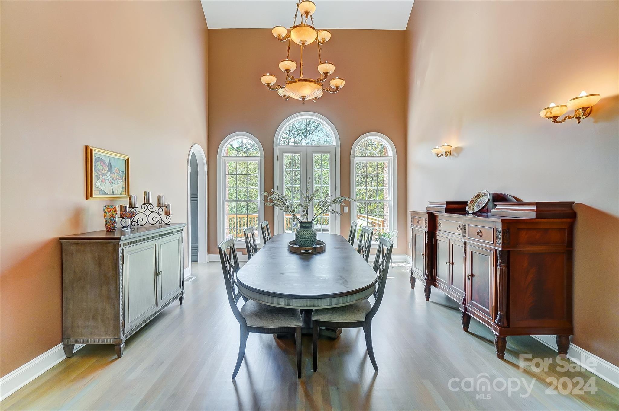 922 Cove Point Lane Tega Cay, SC 29708 - Photo 16 of 48 a view of a dining room with furniture and wooden floor
