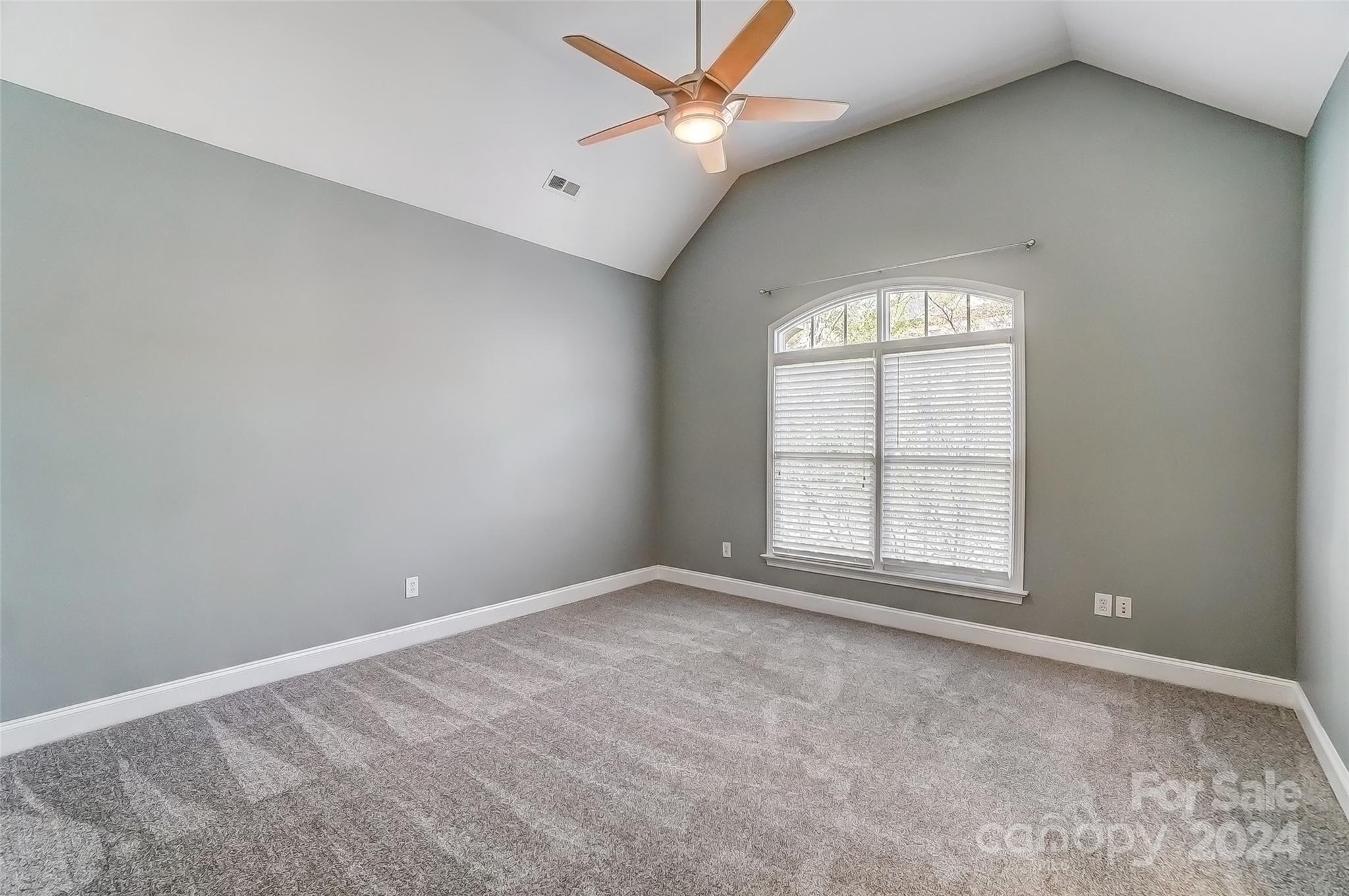 922 Cove Point Lane Tega Cay, SC 29708 - Photo 27 of 48 an empty room with a window and a fan