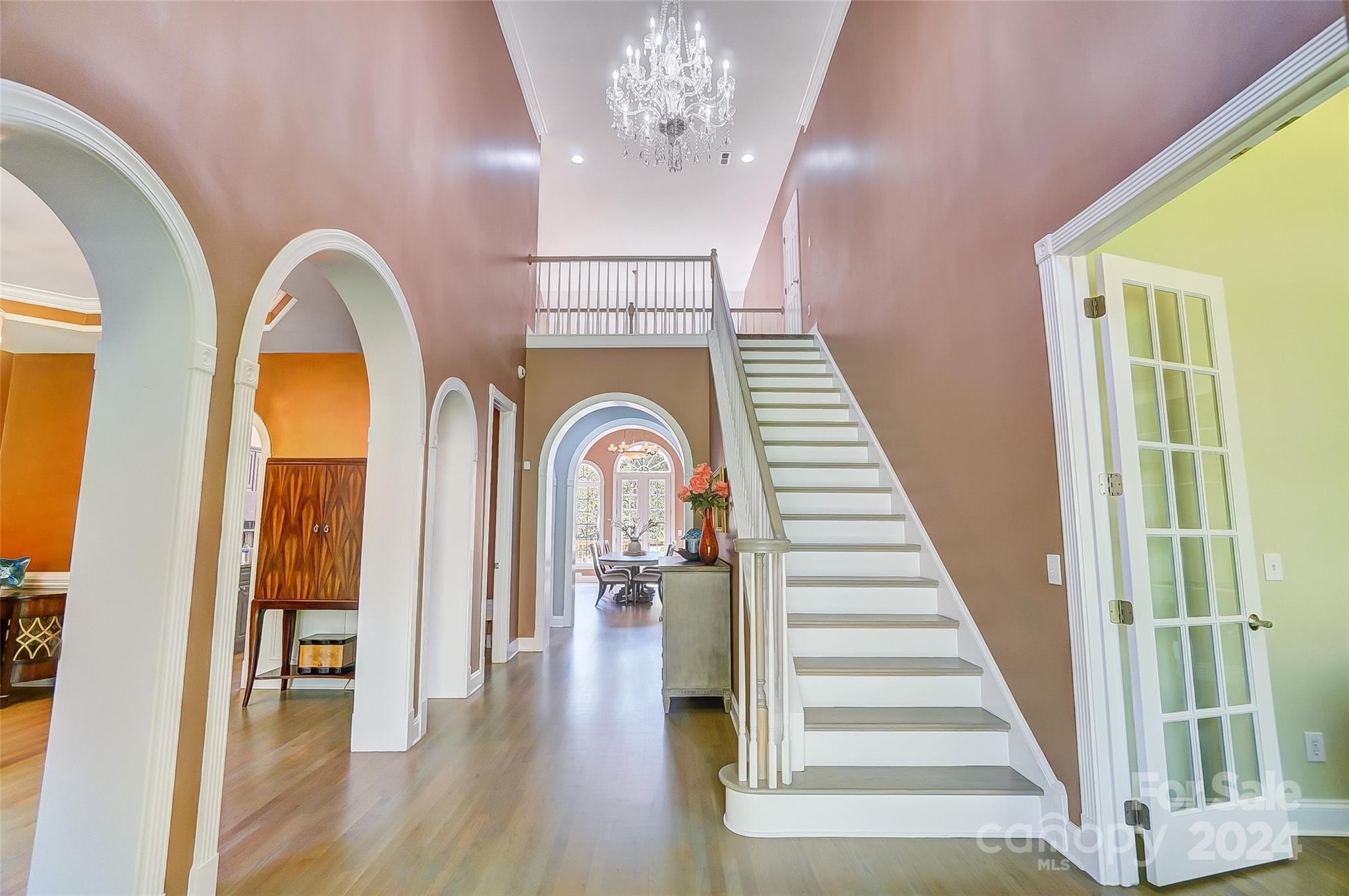 922 Cove Point Lane Tega Cay, SC 29708 - Photo 7 of 48 a view of entryway and hall with wooden floor