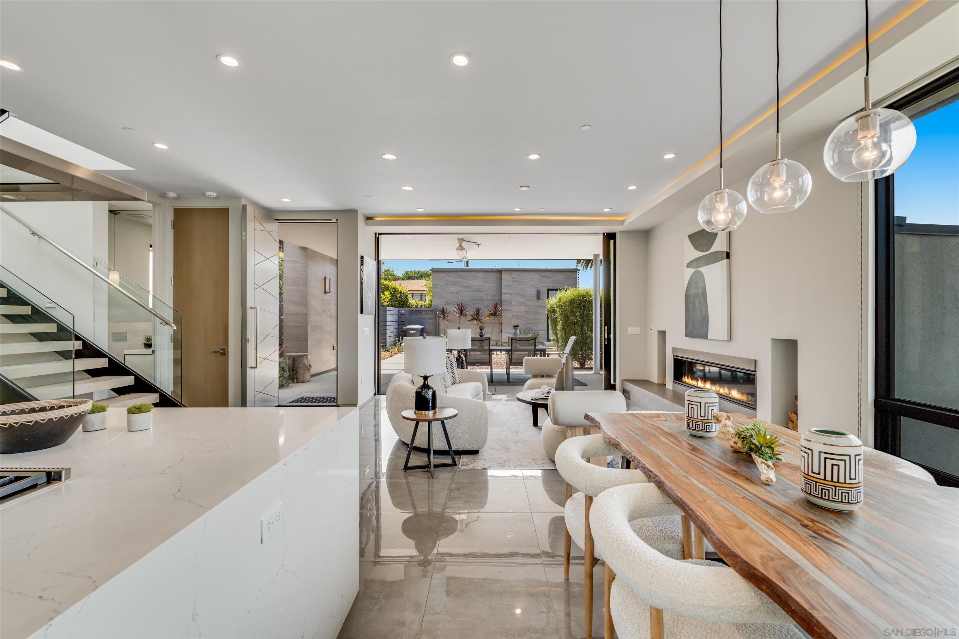 320 11th Street Del Mar, CA 92014 - Photo 13 of 45 a living room with furniture a chandelier and kitchen view