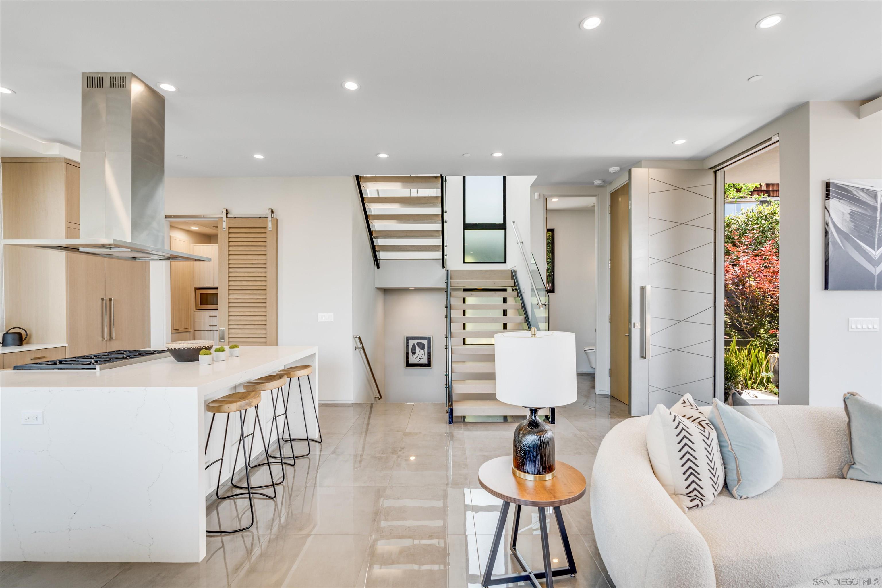 320 11th Street Del Mar, CA 92014 - Photo 14 of 45 a living room with furniture and a large window