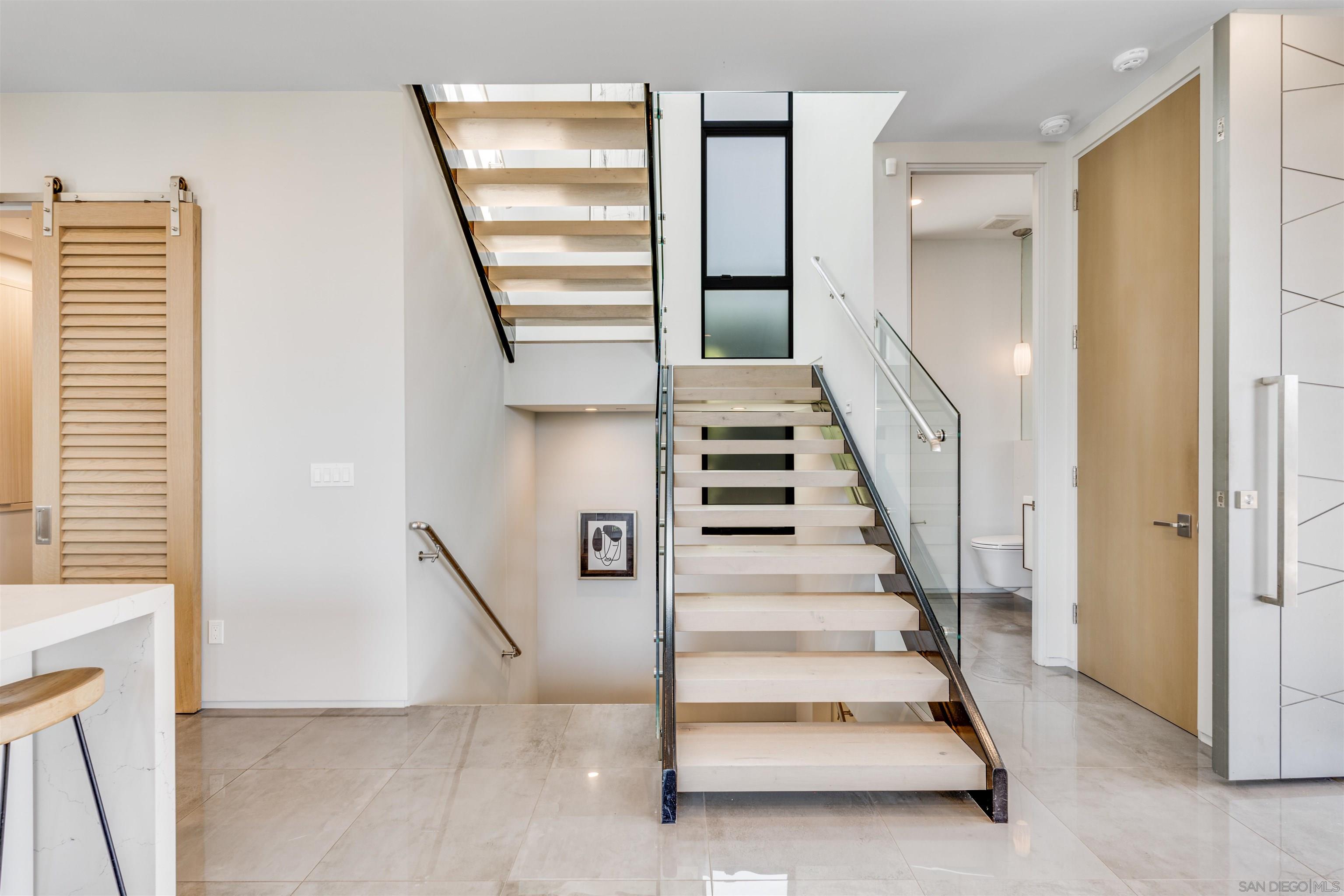 320 11th Street Del Mar, CA 92014 - Photo 15 of 45 a view of entryway and hall with stairs