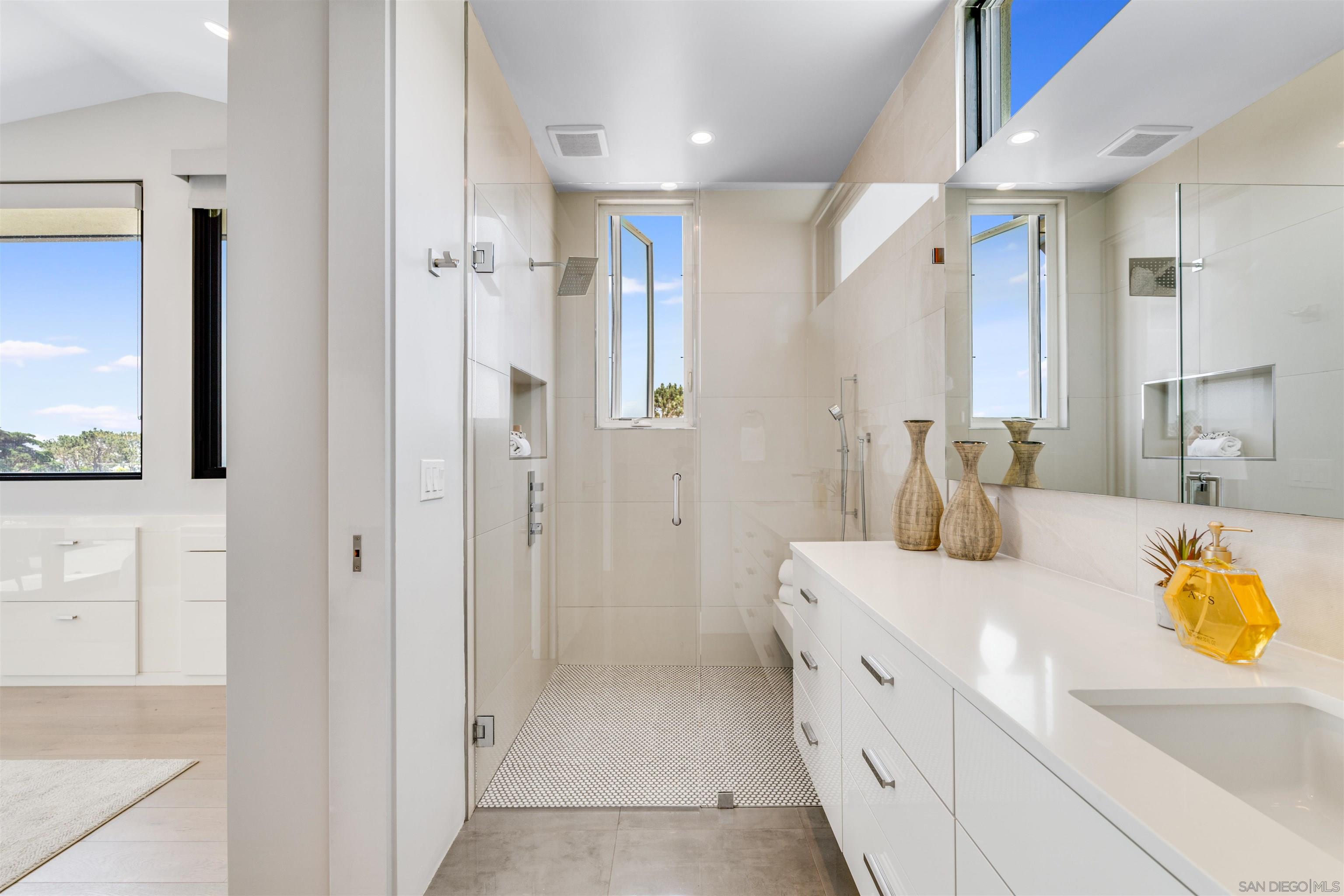 320 11th Street Del Mar, CA 92014 - Photo 22 of 45 a bathroom with a double vanity sink mirror and shower