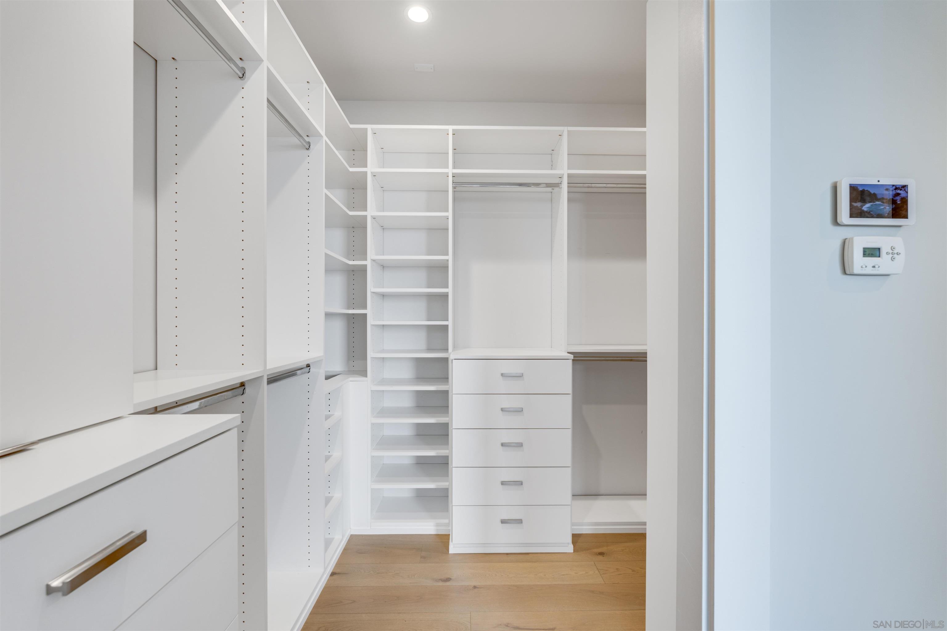 320 11th Street Del Mar, CA 92014 - Photo 24 of 45 a view of walk in closet with empty racks
