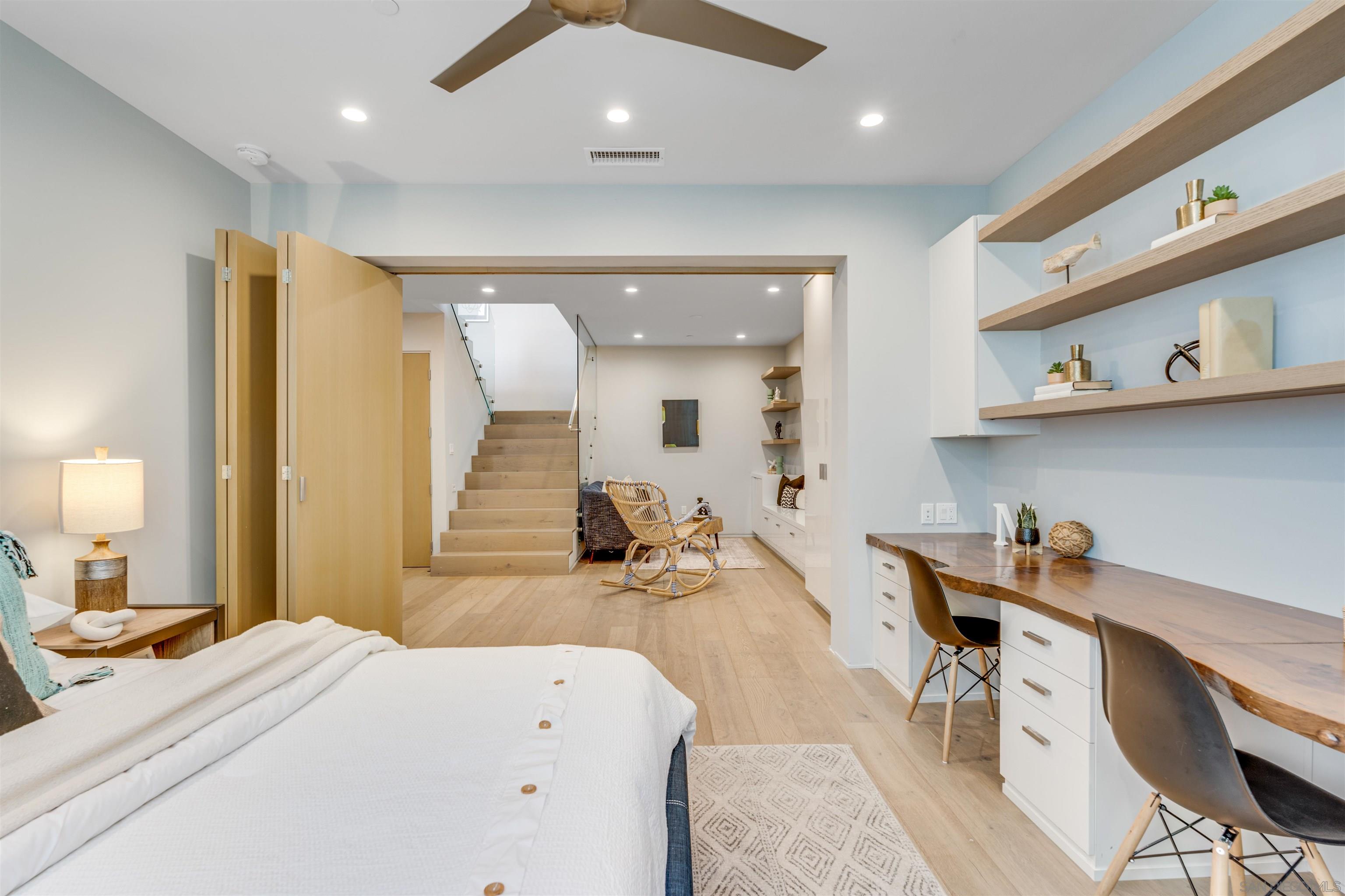 320 11th Street Del Mar, CA 92014 - Photo 26 of 45 a bedroom with a bed and a large mirror on the dresser