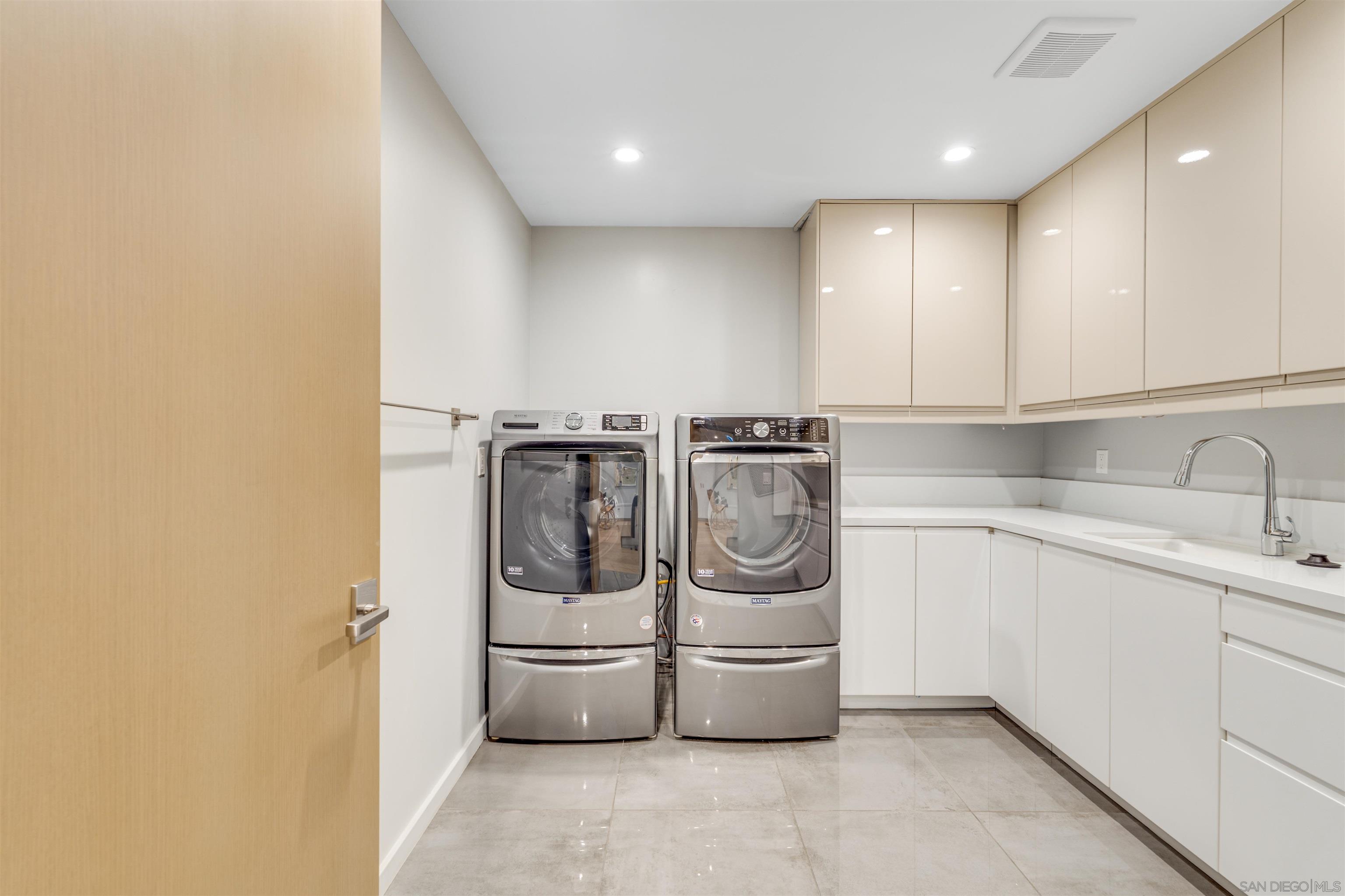 320 11th Street Del Mar, CA 92014 - Photo 27 of 45 a view of a storage & utility room with two washing machine