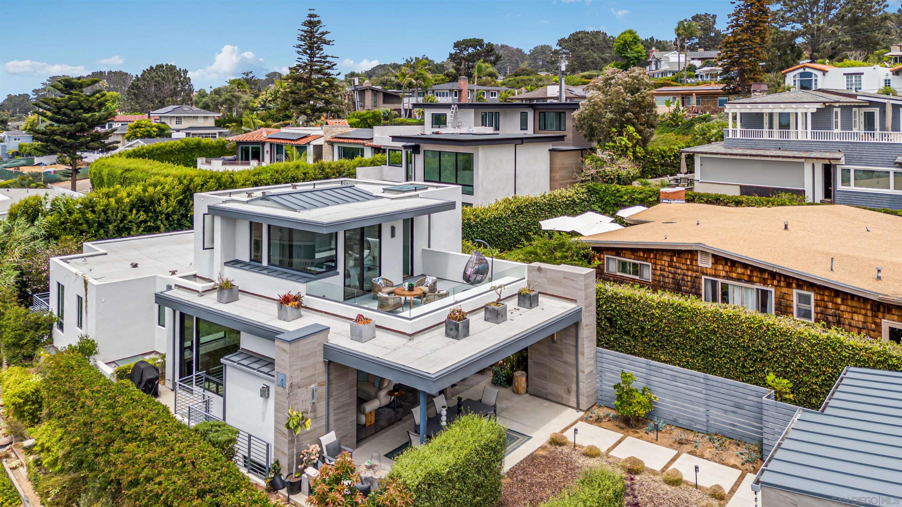320 11th Street Del Mar, CA 92014 - Photo 3 of 45 an aerial view of a house with a garden and outdoor seating