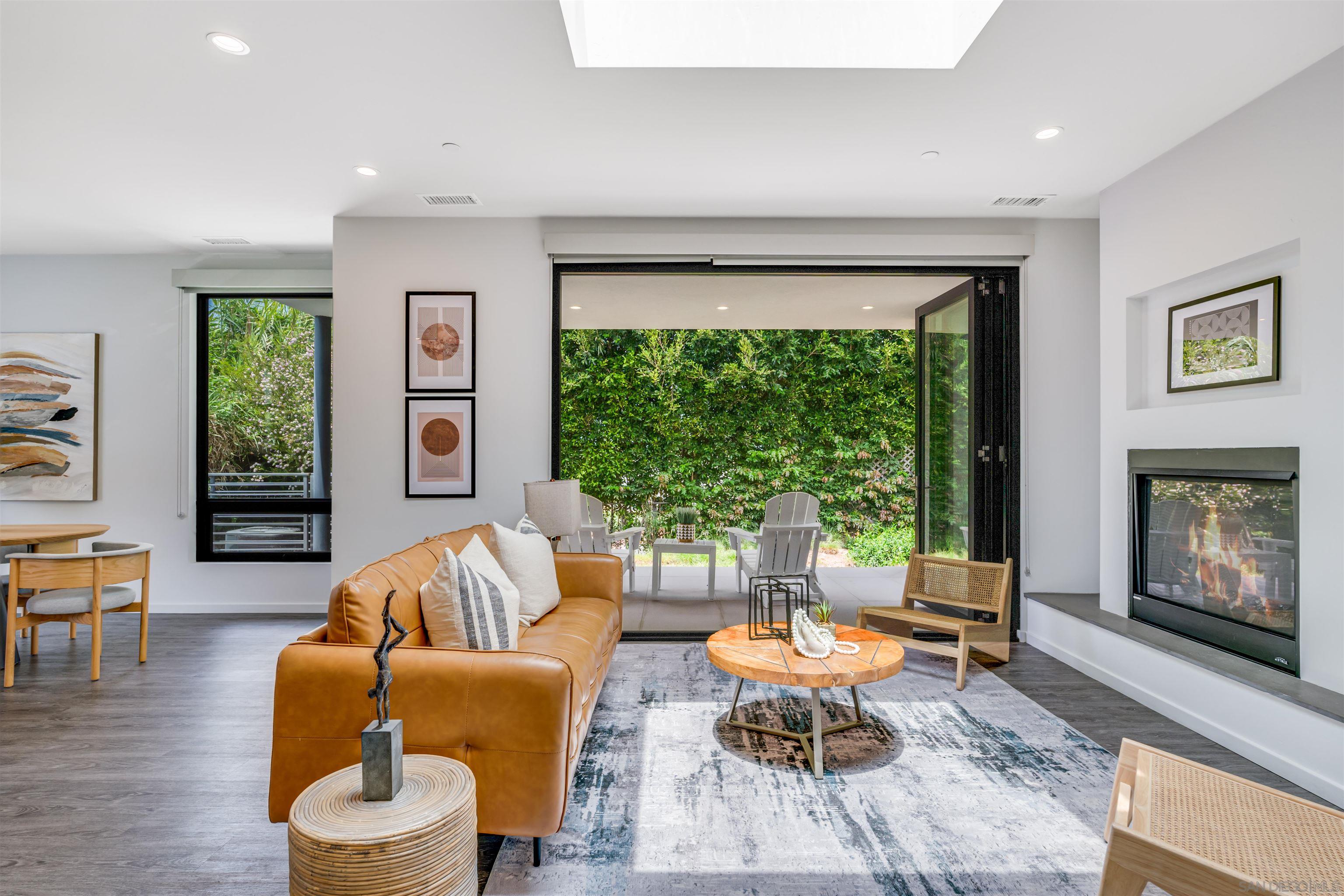 320 11th Street Del Mar, CA 92014 - Photo 32 of 45 a living room with furniture and a fireplace