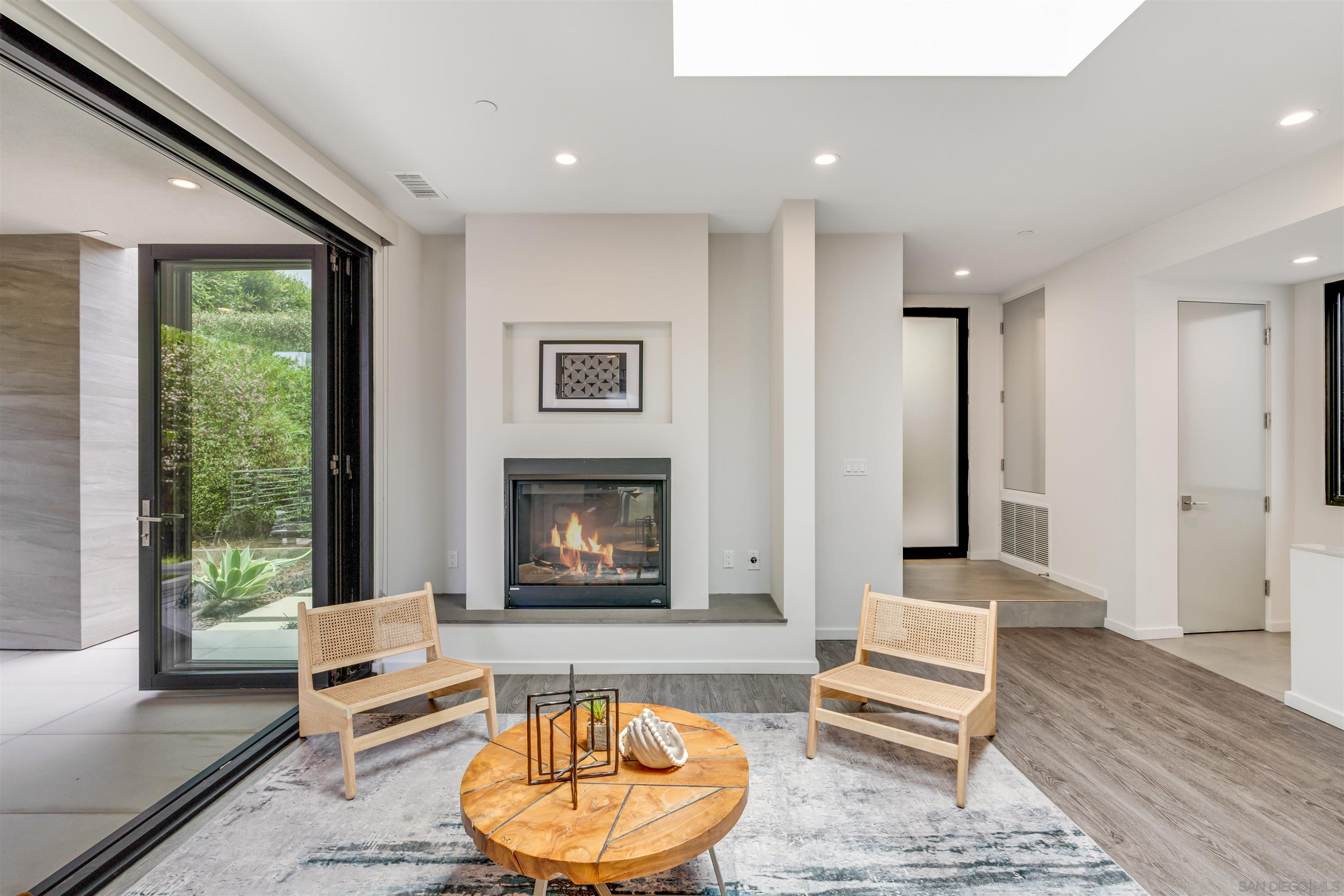 320 11th Street Del Mar, CA 92014 - Photo 35 of 45 a living room with furniture and a fireplace