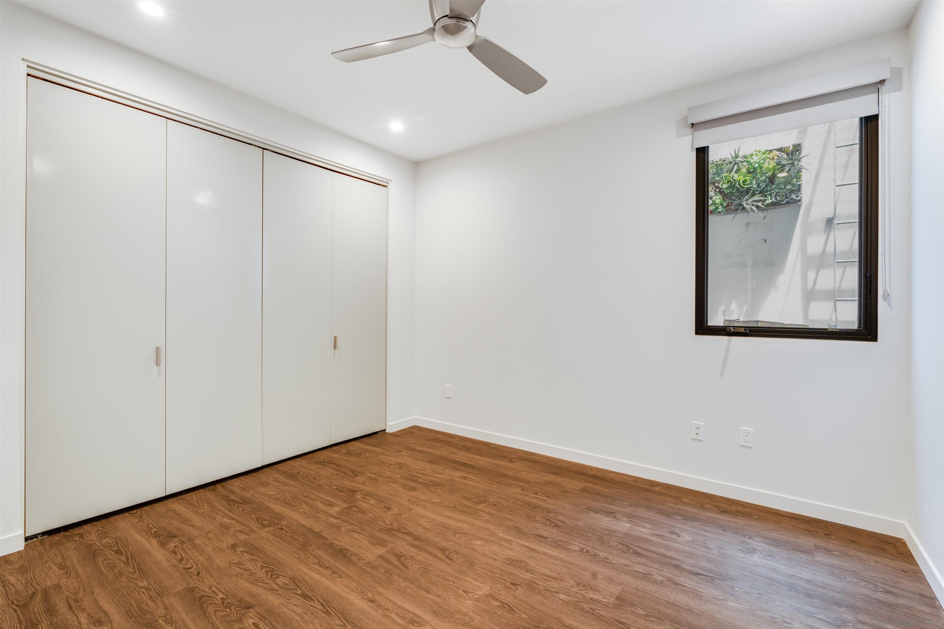 320 11th Street Del Mar, CA 92014 - Photo 42 of 45 a view of empty room with wooden floor and fan