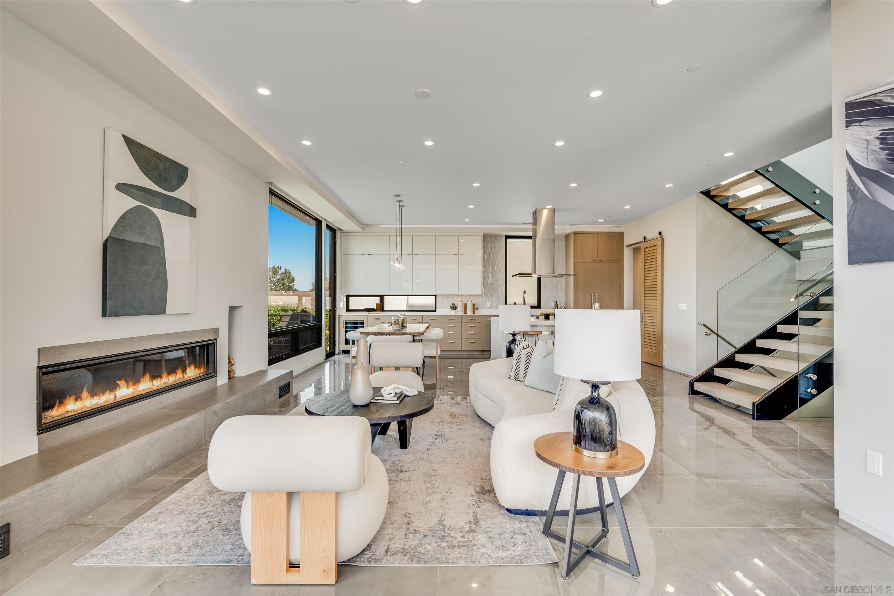 320 11th Street Del Mar, CA 92014 - Photo 7 of 45 a living room with couches and a fireplace with wooden floor