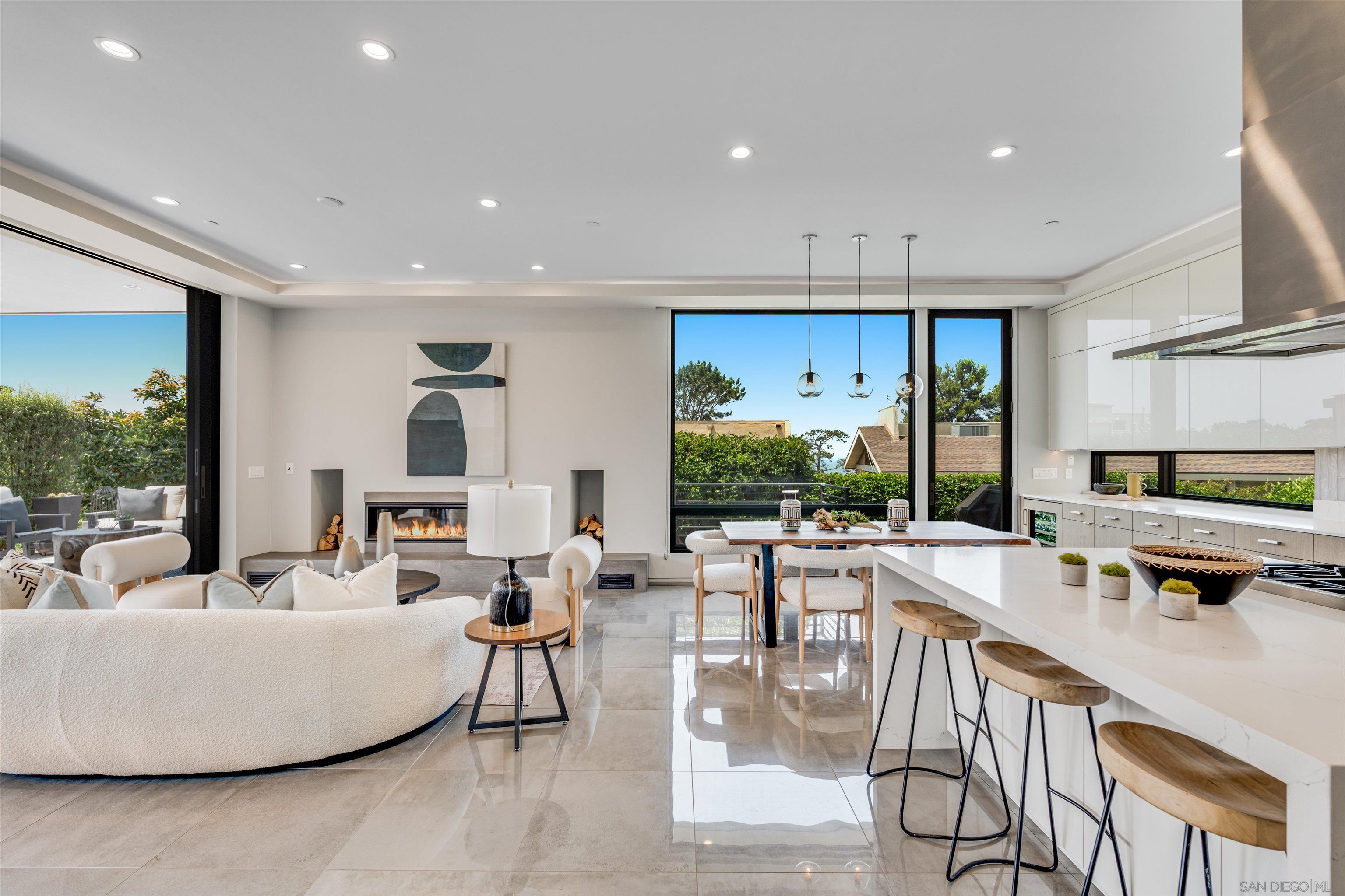 320 11th Street Del Mar, CA 92014 - Photo 9 of 45 a living room with couches and kitchen view with wooden floor