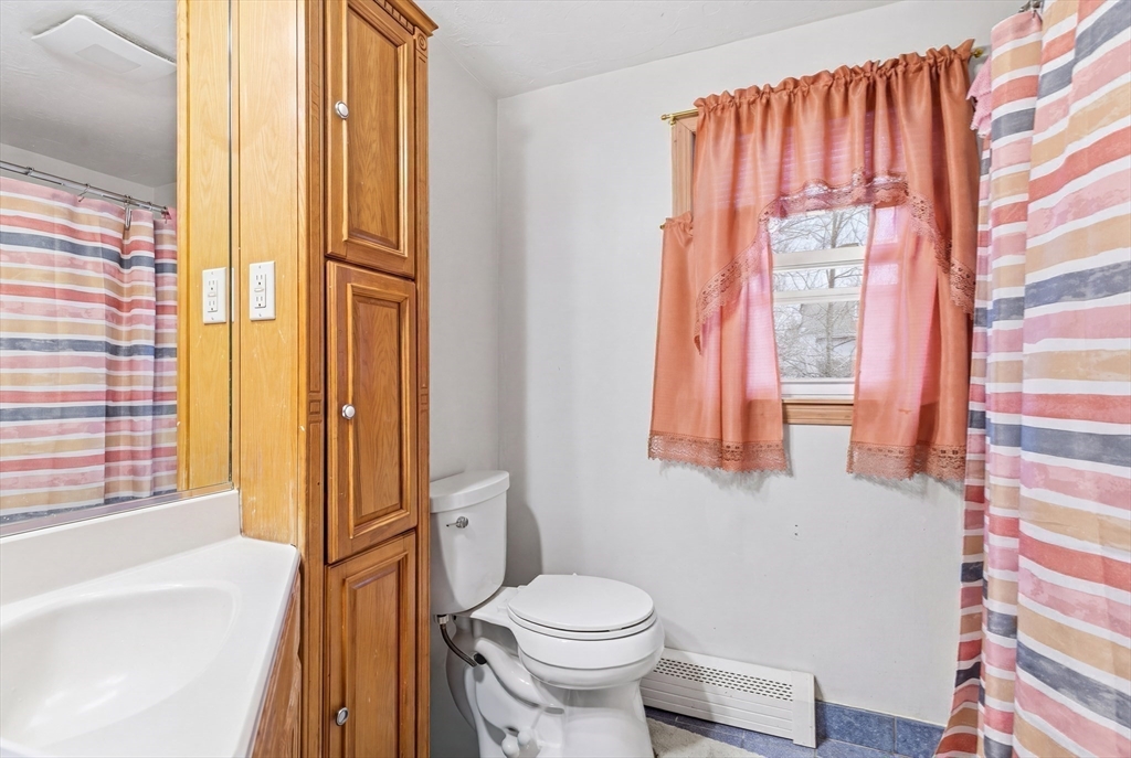 19 Clark Street Randolph, MA 02368 - Photo 19 of 30 a bathroom with a toilet and a shower