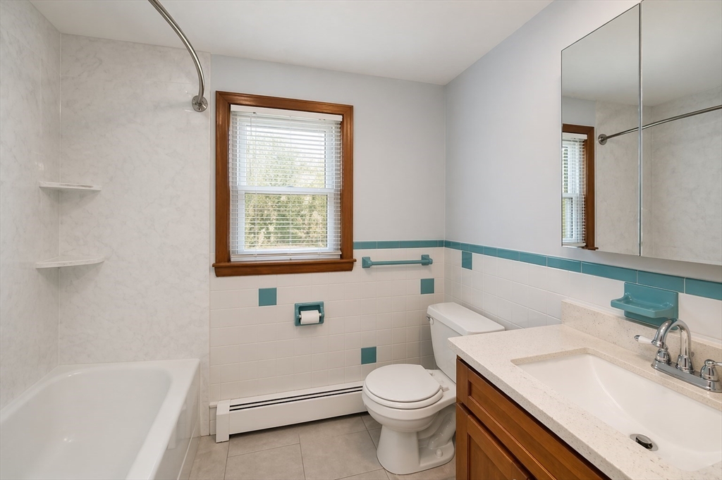 19 Clark Street Randolph, MA 02368 - Photo 20 of 30 a bathroom with a sink toilet and shower