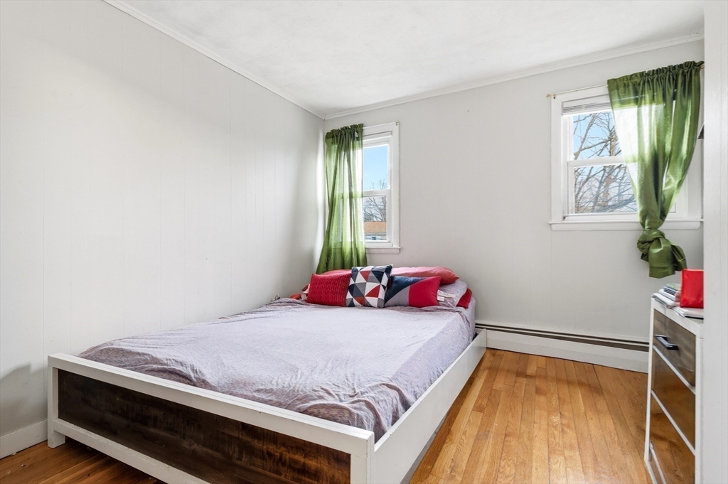 19 Clark Street Randolph, MA 02368 - Photo 22 of 30 a bedroom with a bed and a window