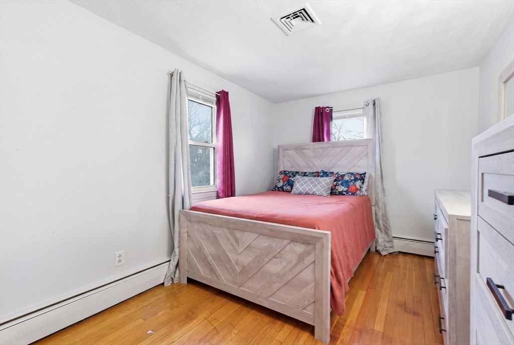 19 Clark Street Randolph, MA 02368 - Photo 23 of 30 a bedroom with a bed and a tv
