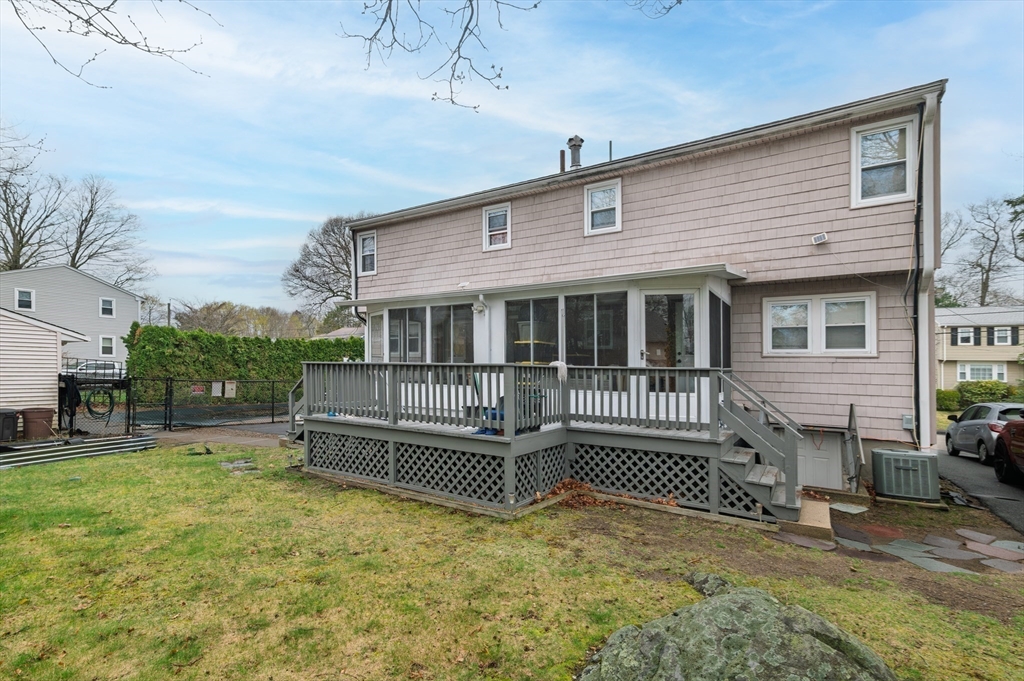 19 Clark Street Randolph, MA 02368 - Photo 3 of 30 a view of a house with a bed in the patio