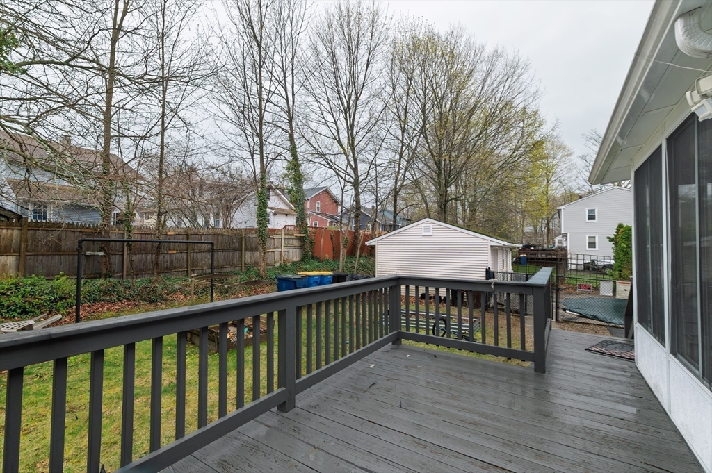 19 Clark Street Randolph, MA 02368 - Photo 4 of 30 a view of a street with wooden bench next to a yard