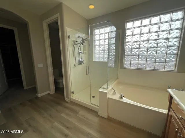 a bathroom with a bathtub and a shower