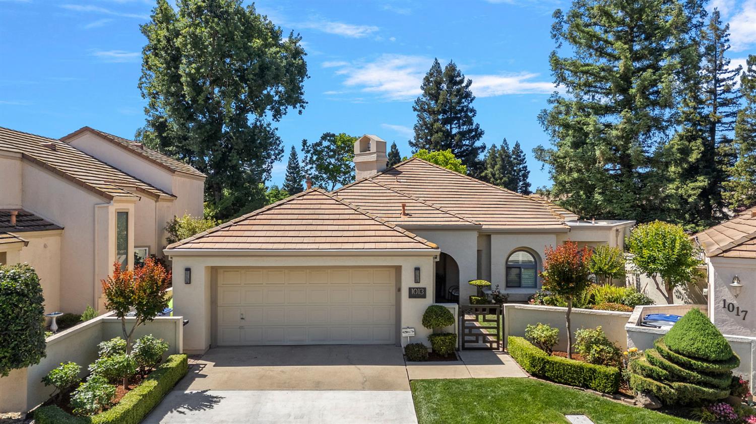 1013 Copper Lake Court Modesto, CA 95355 - Photo 1 of 66 a front view of house with trees in the background