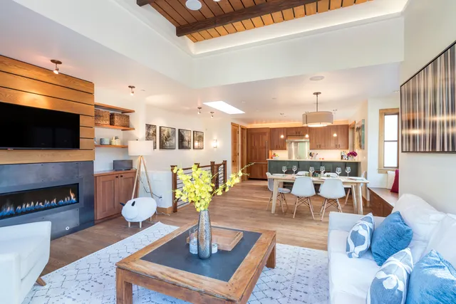 a living room with fireplace furniture and a flat screen tv