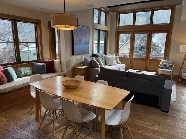 a view of a dining room with furniture window and outside view
