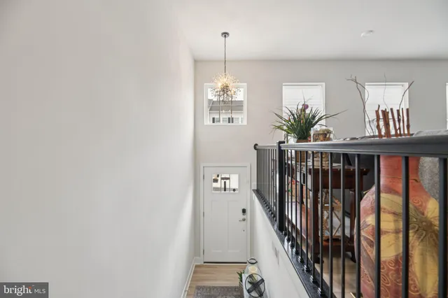 a view of a hallway with windows and stairs