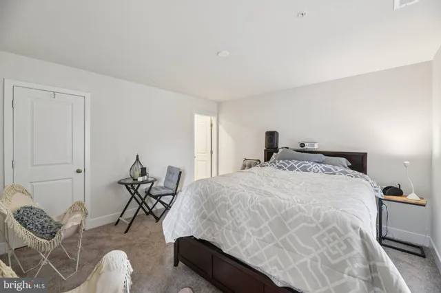 a bedroom with bed and a window