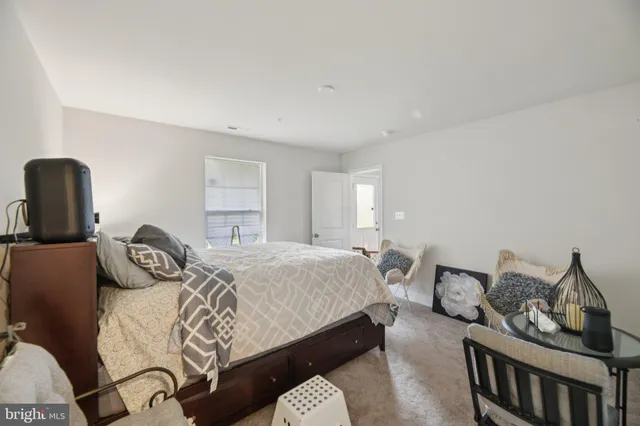 a bedroom with a bed and chair