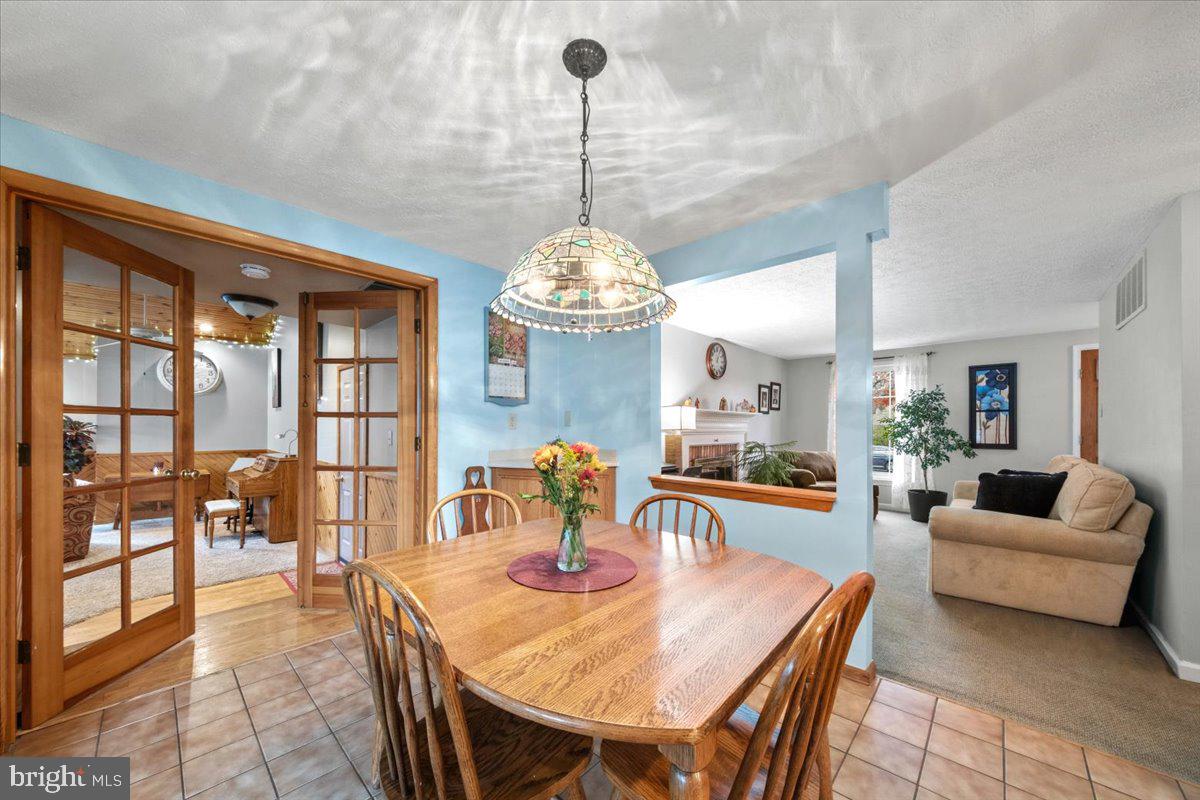 248 Winding Way Marlton, NJ 08053 - Photo 12 of 41 a living room with dining table and a large window