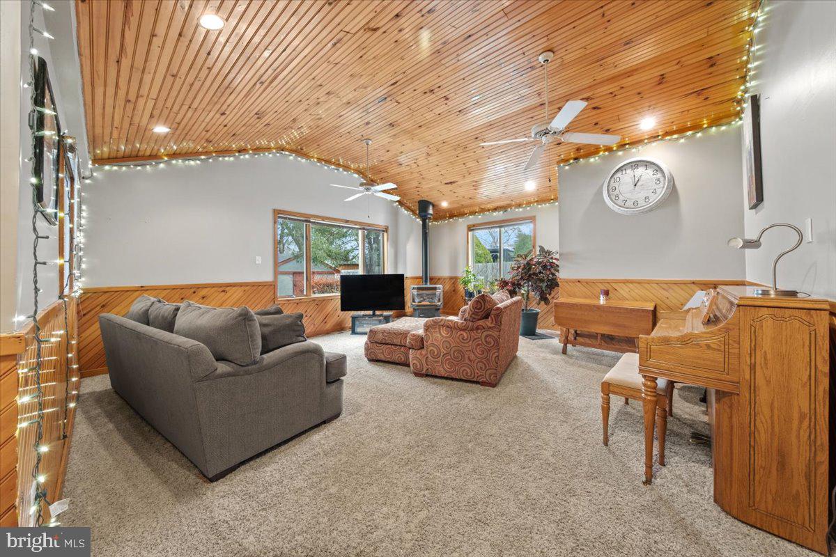 248 Winding Way Marlton, NJ 08053 - Photo 15 of 41 a living room with furniture a clock and a window