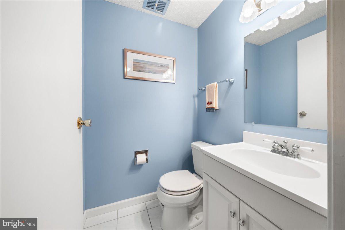 248 Winding Way Marlton, NJ 08053 - Photo 22 of 41 a white toilet sitting next to a bathroom sink