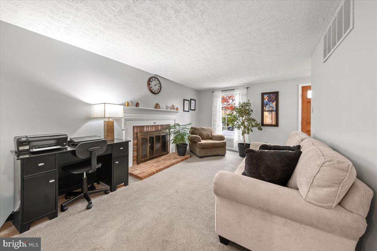 248 Winding Way Marlton, NJ 08053 - Photo 23 of 41 a living room with furniture and a fireplace