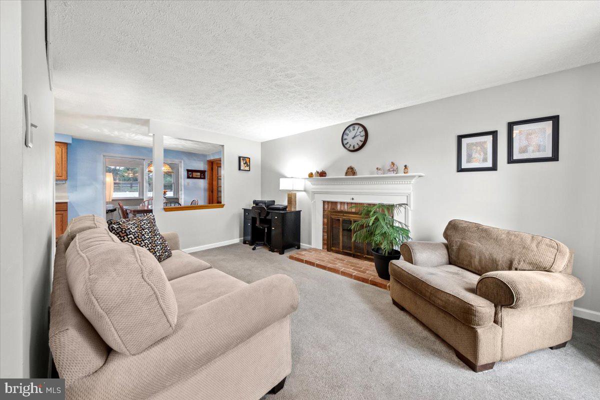 248 Winding Way Marlton, NJ 08053 - Photo 24 of 41 a living room with furniture and a fireplace