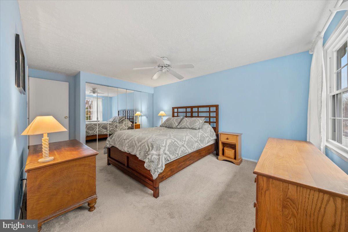 248 Winding Way Marlton, NJ 08053 - Photo 26 of 41 a bedroom with bed and a chandelier