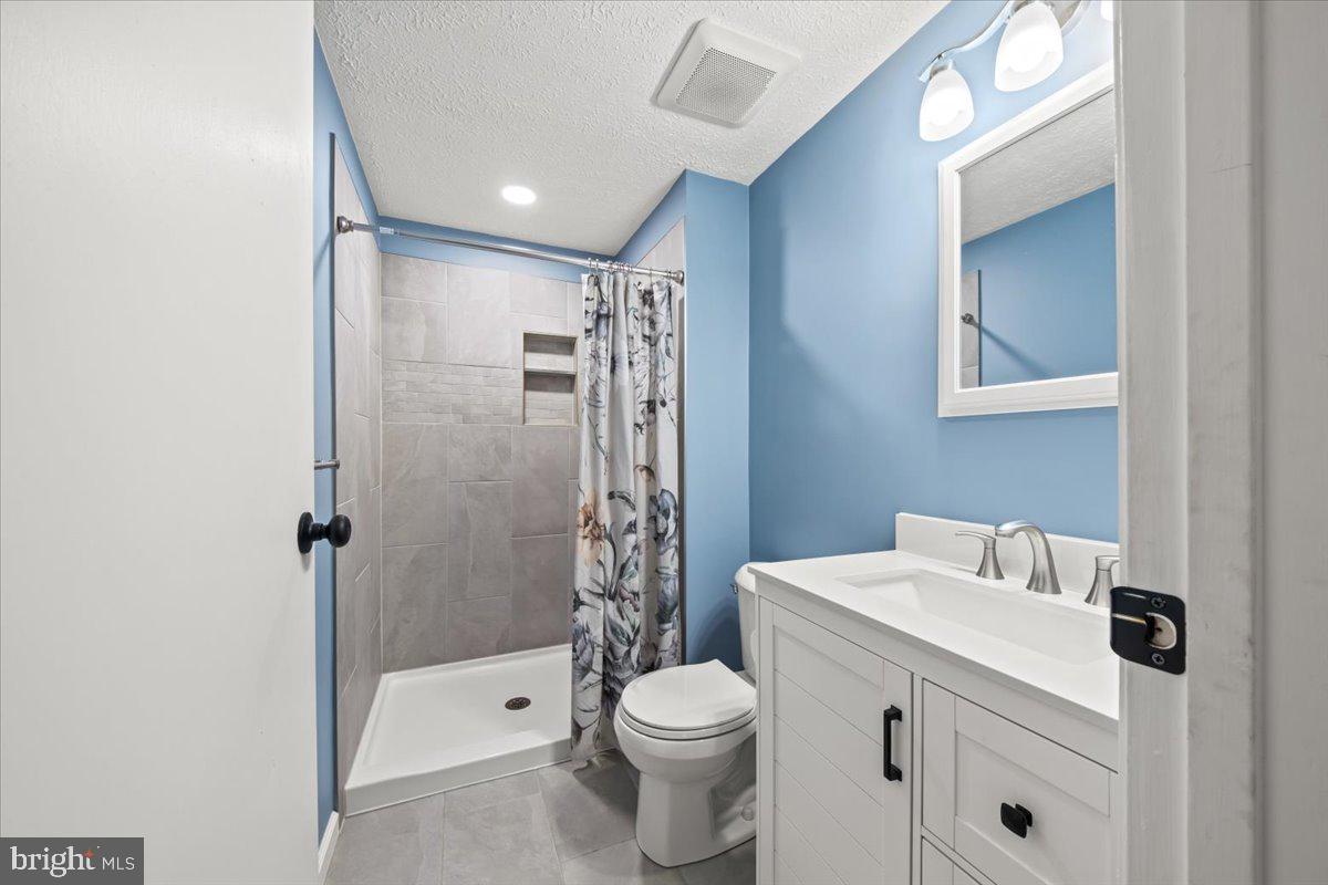 248 Winding Way Marlton, NJ 08053 - Photo 29 of 41 a bathroom with a sink toilet and shower