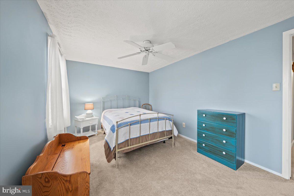 248 Winding Way Marlton, NJ 08053 - Photo 30 of 41 a bedroom with a bed and a ceiling fan