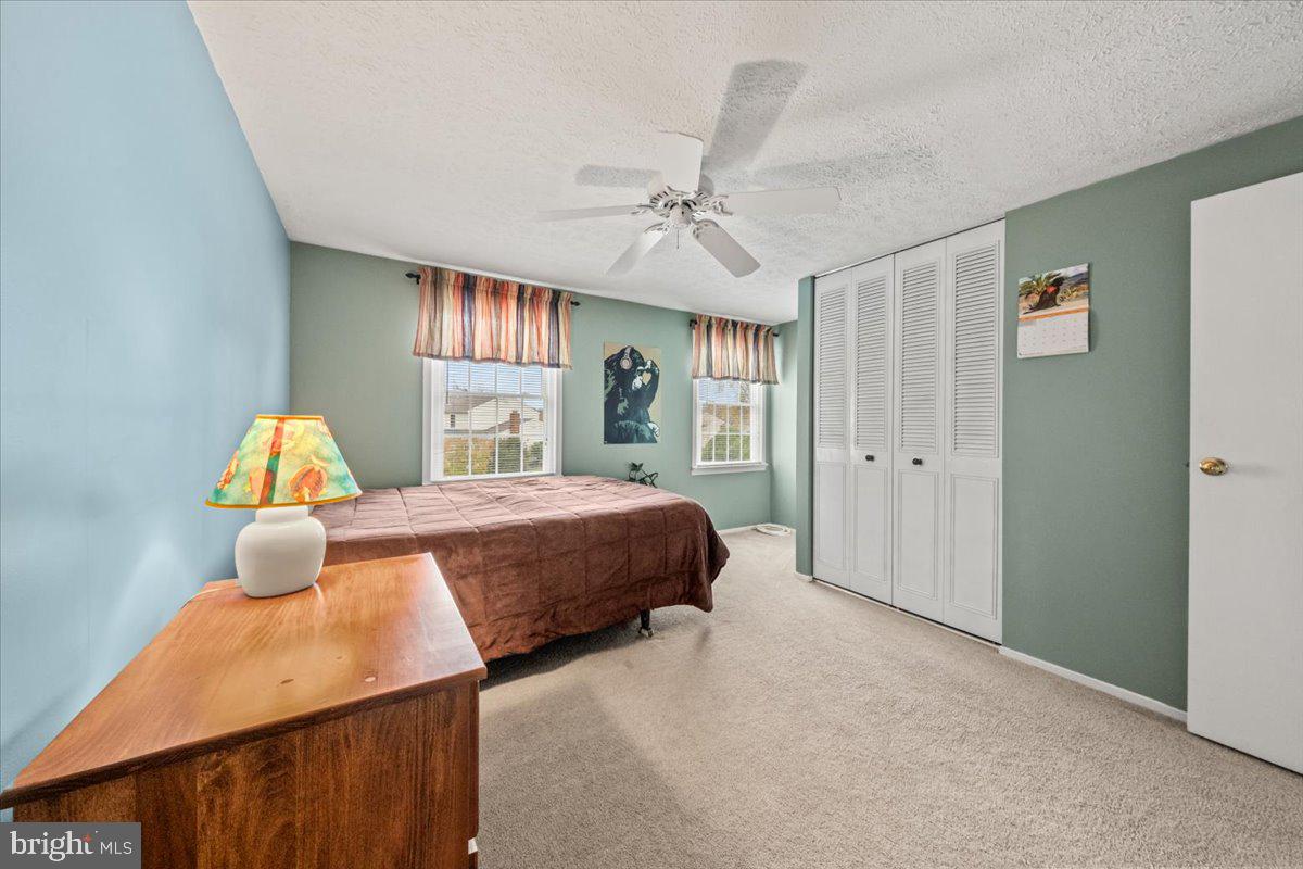 248 Winding Way Marlton, NJ 08053 - Photo 31 of 41 a bedroom with a bed table and window