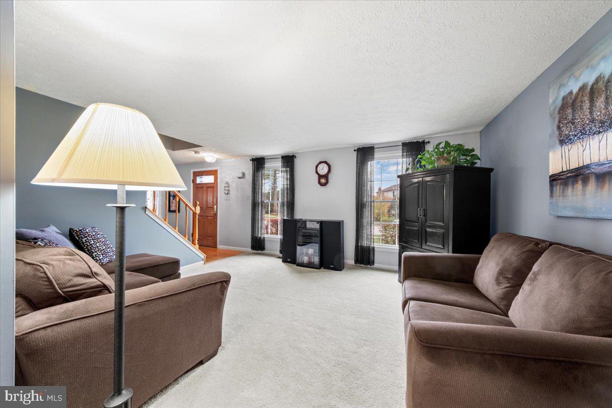 248 Winding Way Marlton, NJ 08053 - Photo 6 of 41 a living room with furniture and a lamp