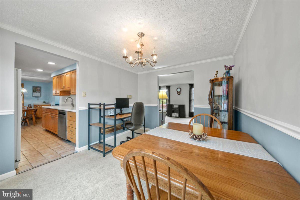 248 Winding Way Marlton, NJ 08053 - Photo 9 of 41 a bedroom with a bed and a view of kitchen