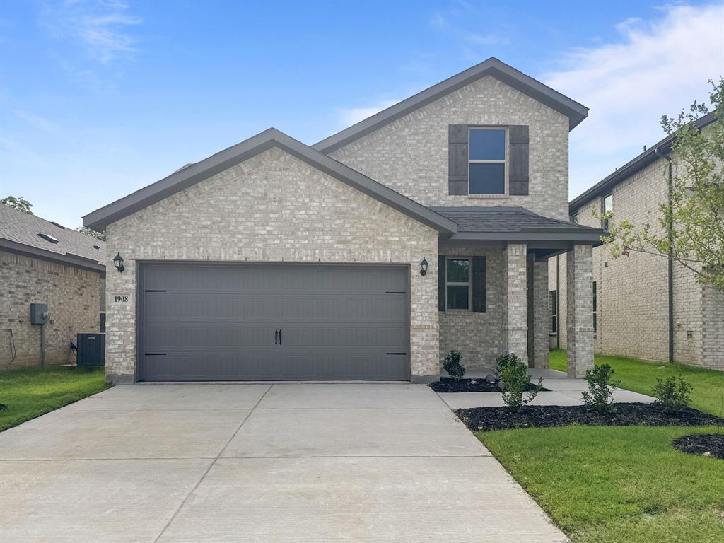 1908 Iris Road Melissa, TX 75454 - Photo 2 of 30 a front view of a house with a yard and garage