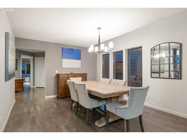 a view of a dining room with furniture and window