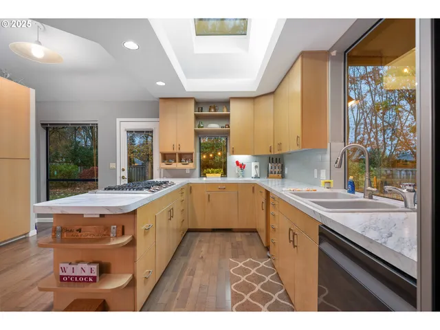 a large kitchen with a large window