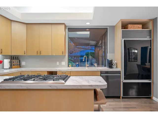 a view of kitchen with wooden floor