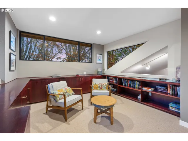 a bedroom with a bed and a chair